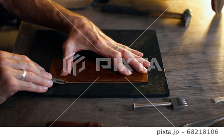 Man holding crafting tool and working. Man holding crafting tool and working. 68218106