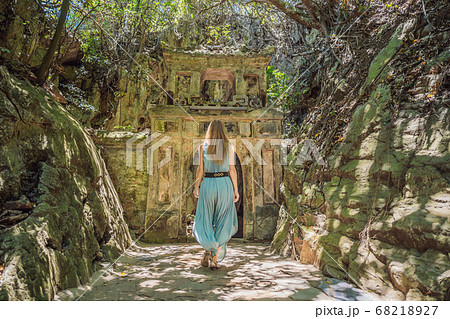 Woman tourist on the background of Beautiful Marble mountains and Da Nang, Vietnam Woman tourist on the background of Beautiful Marble mountains and Da Nang, Vietnam 68218927