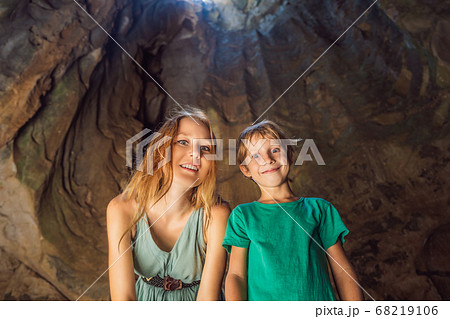 Mom and son tourists in Beautiful Marble mountains and Da Nang, Vietnam. Traveling with children concept Mom and son tourists in Beautiful Marble mountains and Da Nang, Vietnam. Traveling with children concept 68219106