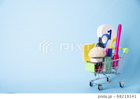 Concept of back to school. Shopping cart with 68219141