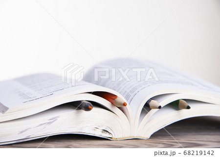 Book with colorful bookmarks with pencils on a Book with colorful bookmarks with pencils on a 68219142