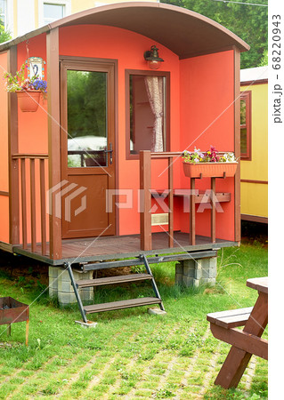 Camping in nature.Small multi-colored houses on wheels. Rest in nature in comfortable conditions. 68220943