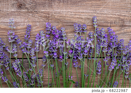 Lavender flowers on a wooden background. Lavender flowers on a wooden background. 68222987