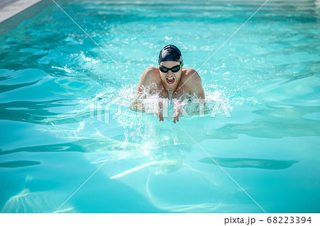 Swimmer with open mouth in water in pool Swimmer with open mouth in water in pool 68223394