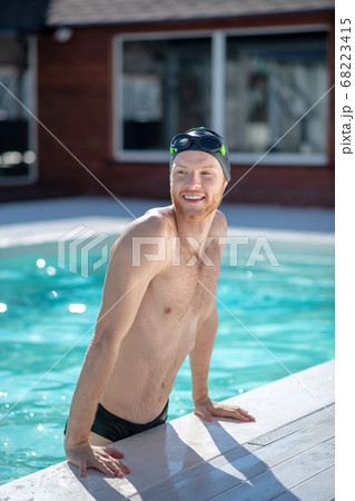 Young guy in an open swimming pool Young guy in an open swimming pool 68223415