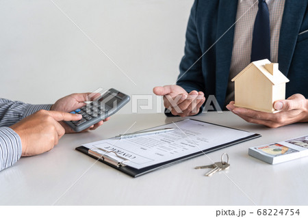 Real estate agent are presenting home loan and Real estate agent are presenting home loan and 68224754