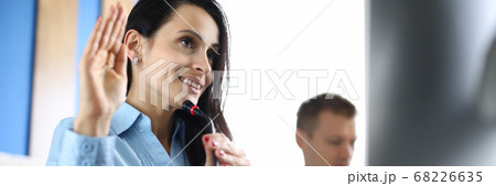 Business woman welcomes interlocutor of conference call 68226635