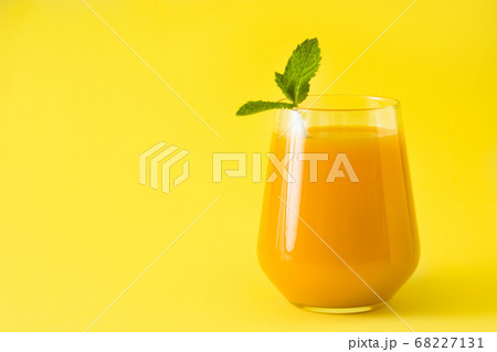 Mango Lassi dessert. Traditional Indian drink on yellow background 68227131
