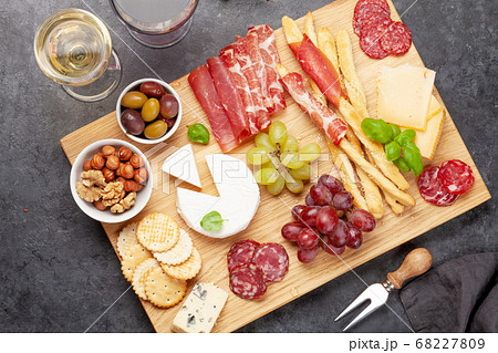 Cheese, meat, grapes and olives antipasto Cheese, meat, grapes and olives antipasto 68227809