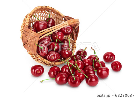 red sweet cherry in a wicker basket isolated on white background with clipping path and full depth of field 68230637