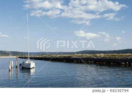 white yacht and blue water adriatic sea, Slovenia. Clear sky with small clouds. Nautical 68230794