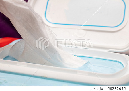 Wet towel wipes out of packaging close up Wet towel wipes out of packaging close up 68232056