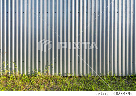 Gray metallic vertical material wall background. Gray metallic vertical material wall background. 68234396