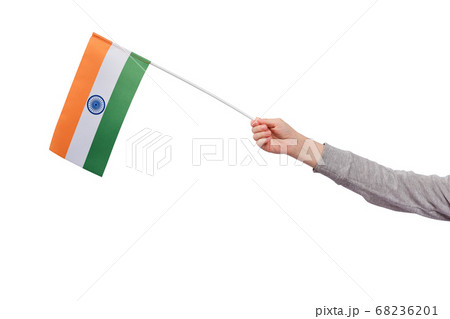 Childrens hand holds flag of India isolated on 68236201