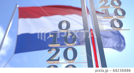 Thermometer shows 0 zero air temperature near flying flag of the Netherlands. Weather forecast conceptual 3D rendering 68236886