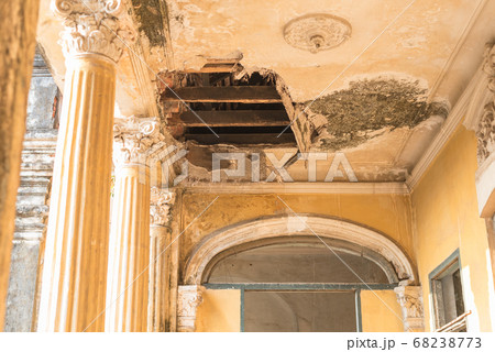 Hole in the plaster ceiling in the Mansion or Villa Bodega, a half-ruined colonial-era building (1910-1920s) in Phnom Penh city center, Cambodia. Hole in the plaster ceiling in the Mansion or Villa Bodega, a half-ruined colonial-era building (1910-1920s) in Phnom Penh city center, Cambodia. 68238773