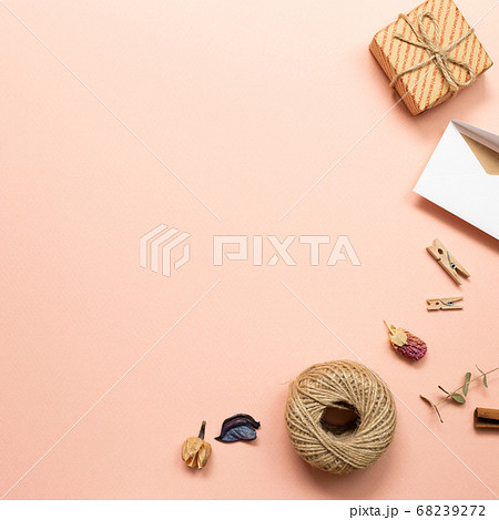 Gift box and card with dry plant on pink background. flat lay, top view, copy space Gift box and card with dry plant on pink background. flat lay, top view, copy space 68239272