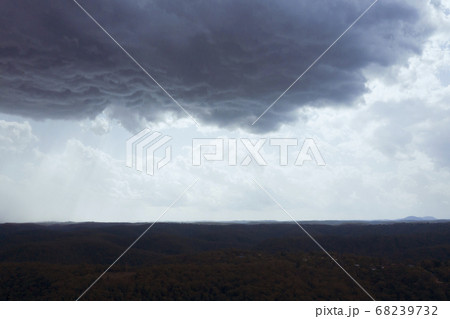 A severe thunderstorm and rain over a valley in The Blue Mountains in Australia 68239732