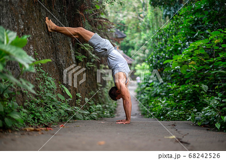 Man practice Yoga practice and meditation outdoor 68242526