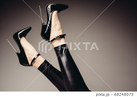 Slender female legs in spandex catsuit and a Slender female legs in spandex catsuit and a 68248073