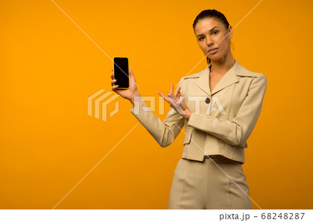 Young girl with facial skin problems posing with a 68248287