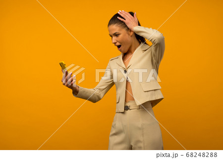 Young girl with facial skin problems posing with a 68248288