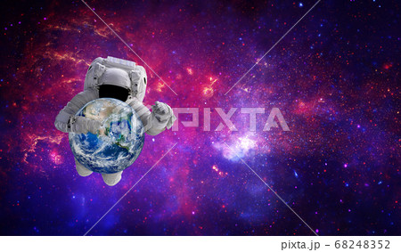 Blue planet earth in hand of Astronaut that floating in the space. 68248352