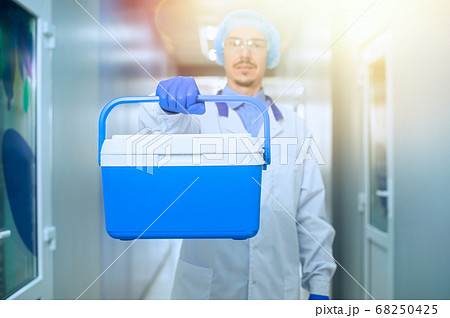 Medical worker, nurse, doctor holding a portable 68250425