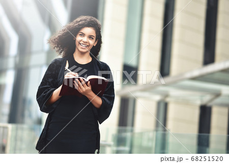 Portrait of a smiling mixed race woman making 68251520