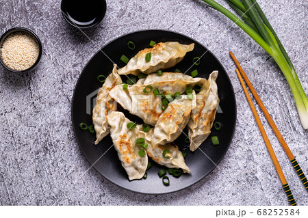 Fried dumplings Gyoza on a plate Fried dumplings Gyoza on a plate 68252584