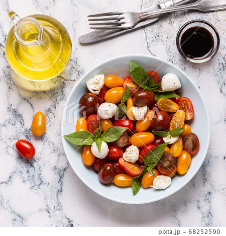 Italian caprese salad with tomatoes, mozzarella Italian caprese salad with tomatoes, mozzarella 68252590