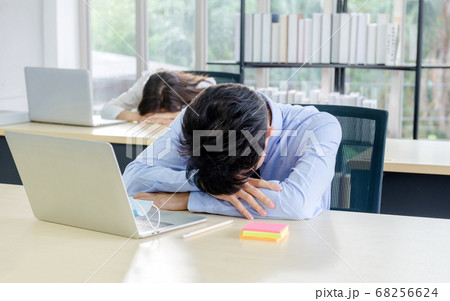 man sleeping in office 68256624