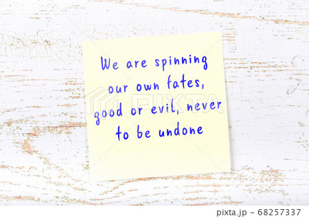 Wise quote on sticky note on wooden wall  68257337