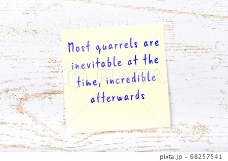 Wise quote on sticky note on wooden wall  68257541