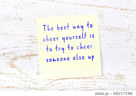 Wise quote on sticky note on wooden wall  68257586