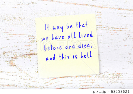 Wise quote on sticky note on wooden wall  68258621