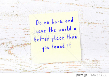 Wise quote on sticky note on wooden wall  68258799