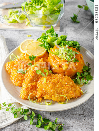 Crispy schnitzel with cornflakes Crispy schnitzel with cornflakes 68258881