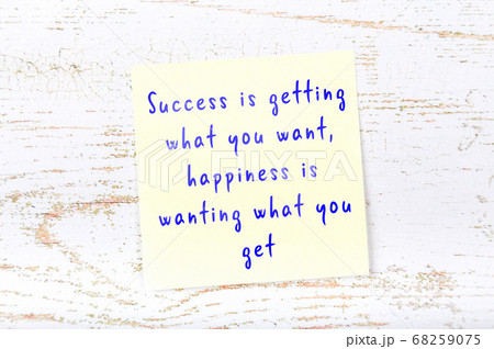 Wise quote on sticky note on wooden wall  68259075