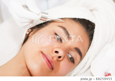 The concept of health, beauty, spa and leisure - beautiful woman and spa receiving massage The concept of health, beauty, spa and leisure - beautiful woman and spa receiving massage 68259455