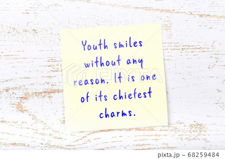 Yellow sticky note on wooden wall with wise quote Yellow sticky note on wooden wall with wise quote 68259484