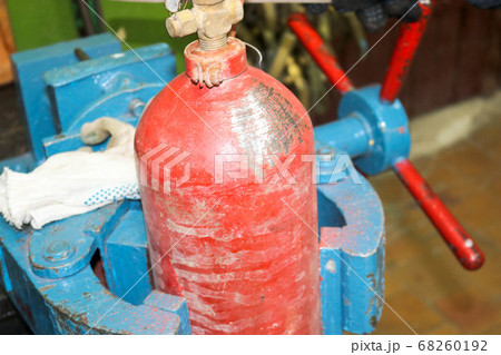 Blue iron metal large industrial vice and red fire 68260192