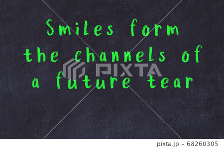 Chalk inscription of smart quote on black desk 68260305