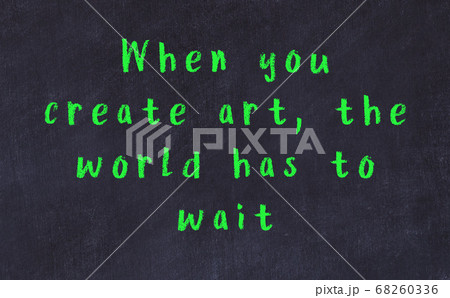 Chalk inscription of smart quote on black desk Chalk inscription of smart quote on black desk 68260336