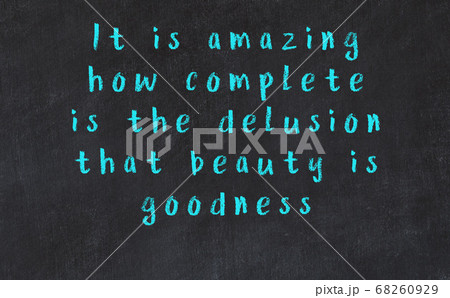 Chalk wise inscription on black chalkboard 68260929