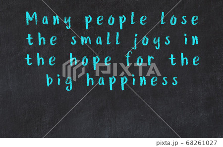 Chalk inscription of smart quote on black desk Chalk inscription of smart quote on black desk 68261027