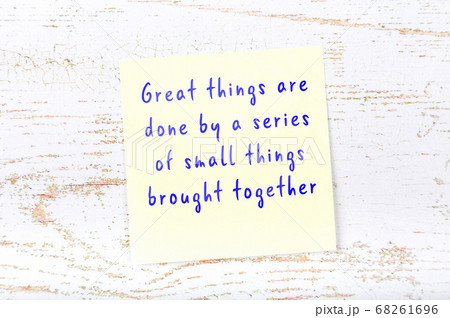 Wise quote on sticky note on wooden wall  68261696