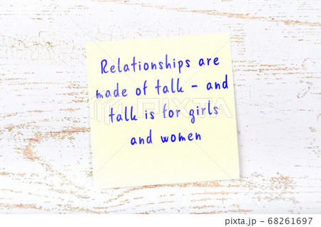 Yellow sticky note on wooden wall with wise quote 68261697