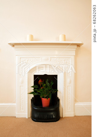 Traditional English Fireplace. A traditional ornate iron fireplace from an 19th century English home.	 68262063