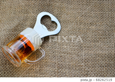 Yellow metal opener for bottles with a handle Yellow metal opener for bottles with a handle 68262519